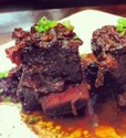 Sangiovese braised short ribs with cranberries and brown onions